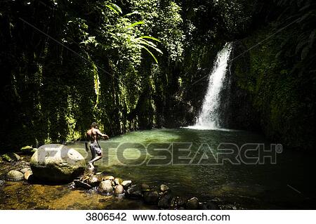 A young man in front of the Seven sisters waterfall, Grenada, West Indies View Large Photo Image Stock Image - A young man in front of the Seven sisters waterfall, Grenada, West Indies. Fotosearch