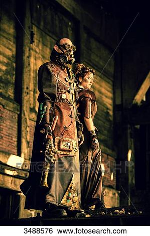 Stock Photograph - Armed steampunk couple. Fotosearch