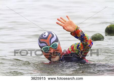 Stock Photography - Asia, China, Shandong Province, Qingdao. Huiquan Bay, Beach Number 1. Facekini. Fotosearch