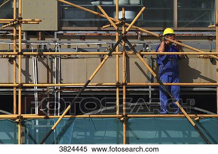 Asia, China, Shanghai. Man at work View Large Photo Image Stock Photography - Asia, China, Shanghai. Man at work. Fotosearch