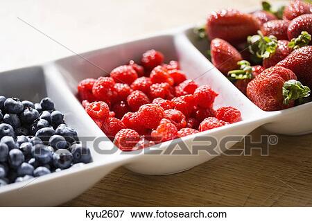 Stock Photo - Assorted berries on a tray. Fotosearch
