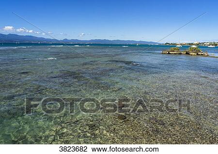 Stock Image - At the seaside, Gosier island, Guadeloupe, France. Fotosearch