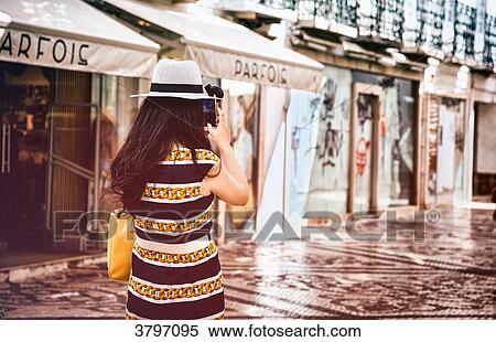 back tourist taking a picture of a street in the city of Faro, Algarve region, Portugal View Large Photo Image Stock Photography - back tourist taking a picture of a street in the city of Faro, Algarve region, Portugal. Fotosearch
