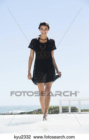 Beautiful woman enjoying on the beach View Large Photo Image Stock Image - Beautiful woman enjoying on the beach. Fotosearch