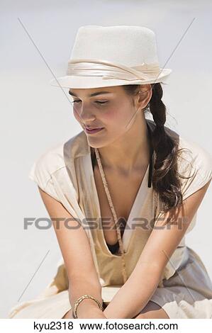 Stock Photo - Beautiful woman on the beach. Fotosearch