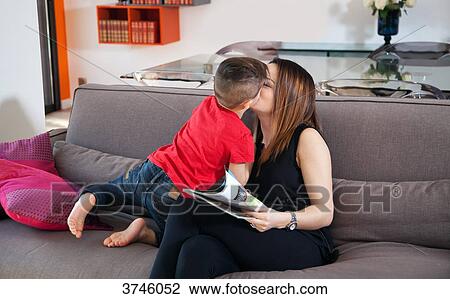 Boy kissing his mother View Large Photo Image Stock Image - Boy kissing his mother. Fotosearch