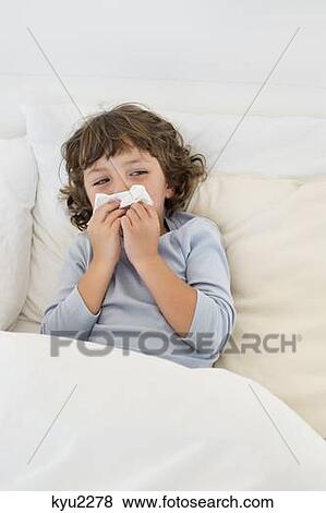Stock Photo - Boy suffering from cold. Fotosearch