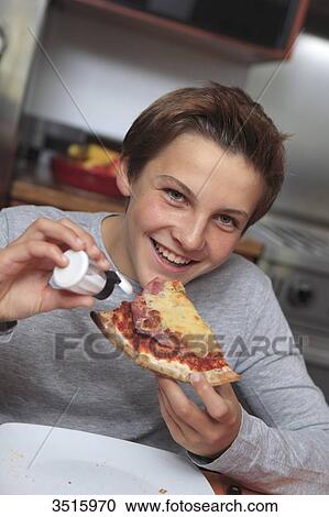 Boy using saltshaker View Large Photo Image Stock Image - Boy using saltshaker. Fotosearch