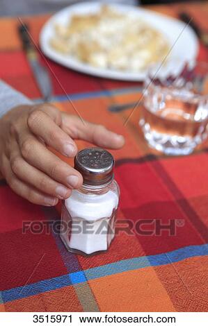 Boy using saltshaker View Large Photo Image Stock Image - Boy using saltshaker. Fotosearch