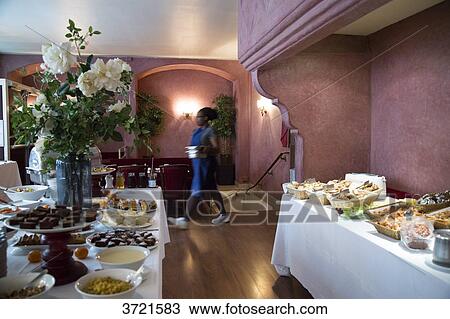 Stock Image - Buffets prepared for brunch in a Parisian restaurant. Fotosearch