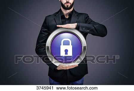 Stock Image - Businessman holding a circle containing the symbol padlock. Fotosearch