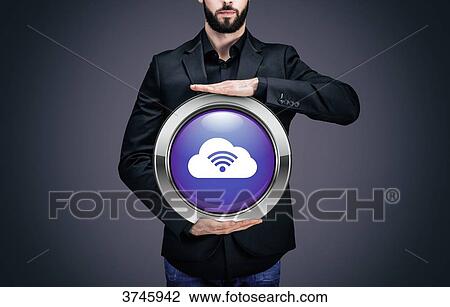 Stock Image - Businessman holding a circle containing the Cloud pictogram. Fotosearch