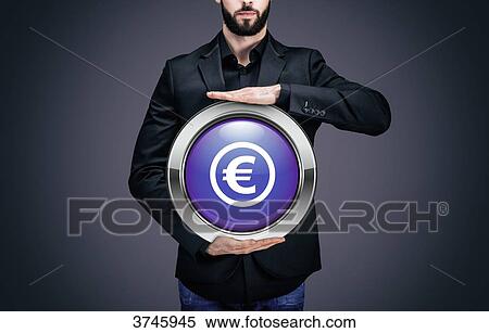 Businessman holding a circle containing the symbol Euro View Large Photo Image Stock Photography - Businessman holding a circle containing the symbol Euro. Fotosearch