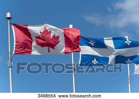Picture - Canada, Province of Quebec. Flags of Canada (left) and province of Quebec (right). Fotosearch