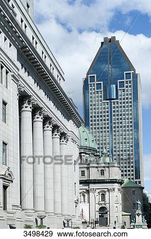 Canada. Province of Quebec, Montreal. The city center. Metcalfe street. The facade with columns of the Building Sun Life ( insurance company), the Marie Reine du Monde cathedral and the tower 1000 of Gauchetiere (the highest skyscraper of Montreal) View Large Photo Image Stock Photo - Canada. Province of Quebec, Montreal. The city center. Metcalfe street. The facade with columns of the Building Sun Life ( insurance company), the Marie Reine du Monde cathedral and the tower 1000 of Gauchetiere (the highest skyscraper of Montreal). Fotosearch