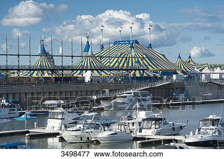Stock Photo - Canada. Province of Quebec, Montreal. The old port. The marina and the Big Top of the Cirque du Soleil. Fotosearch
