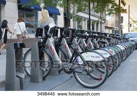 Stock Photography - Canada. Province of Quebec, Montreal. The city center. Self-service Bixi bikes. Fotosearch