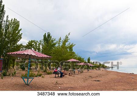 Central Asia, Kyrgyzstan, Issyk Kul Province (Ysyk-Kl), the Issyk Kul lake culminates at 1, 606 m above sea level, beach View Large Photo Image Stock Photo - Central Asia, Kyrgyzstan, Issyk Kul Province (Ysyk-Kl), the Issyk Kul lake culminates at 1, 606 m above sea level, beach. Fotosearch