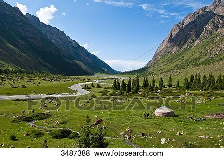 Stock Photo - Central Asia, Kyrgyzstan, Issyk Kul Province (Ysyk-Kl), Juuku valley, every year Tourar Ousounbaev and Nourgul Toktosounova's family setlles for a few months in a yurt in the middle of Juuku Valley. Fotosearch