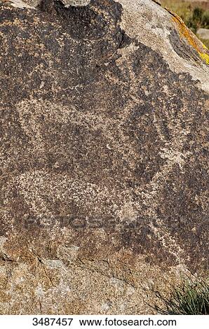 Central Asia, Kyrgyzstan, Issyk Kul Province (Ysyk-Kl), Issyk Kul Lake, Cholpon Ata, petroglyph depicting a hunting scene View Large Photo Image Stock Photo - Central Asia, Kyrgyzstan, Issyk Kul Province (Ysyk-Kl), Issyk Kul Lake, Cholpon Ata, petroglyph depicting a hunting scene. Fotosearch