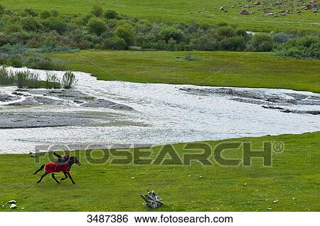 Central Asia, Kyrgyzstan, Issyk Kul Province (Ysyk-Kl), Juuku valley, horse race is a nice way to have fun View Large Photo Image Stock Photograph - Central Asia, Kyrgyzstan, Issyk Kul Province (Ysyk-Kl), Juuku valley, horse race is a nice way to have fun. Fotosearch
