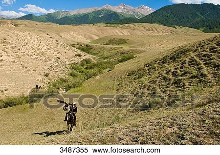 Central Asia, Kyrgyzstan, Issyk Kul Province (Ysyk-Kl), Juuku valley, Talgarbek Chaibirov the eagle hunter and his amulet Toumar View Large Photo Image Stock Photography - Central Asia, Kyrgyzstan, Issyk Kul Province (Ysyk-Kl), Juuku valley, Talgarbek Chaibirov the eagle hunter and his amulet Toumar. Fotosearch