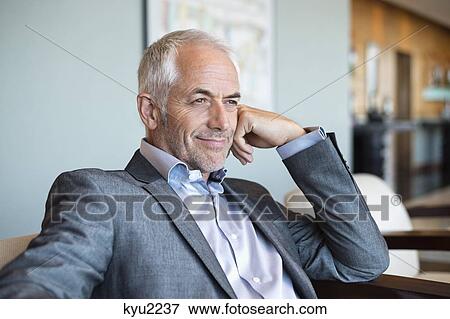Stock Photo - Close-up of a businessman smiling. Fotosearch