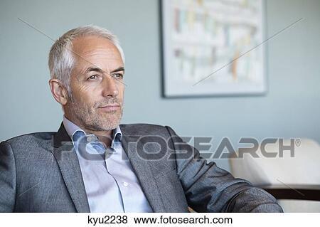 Stock Photo - Close-up of a businessman thinking. Fotosearch