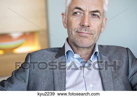 Stock Photo - Close-up of a businessman thinking. Fotosearch