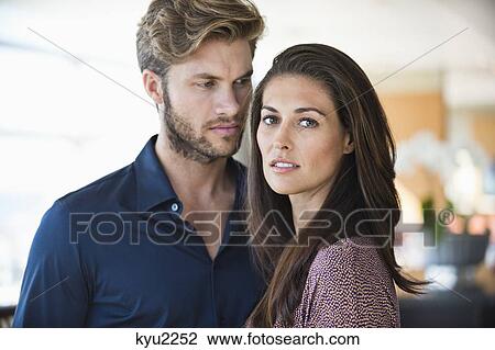 Stock Image - Close-up of a couple standing together. Fotosearch