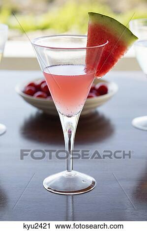 Stock Image - Close-up of a glass of watermelon martini. Fotosearch