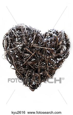 Close-up of a heart shaped showpiece made from wicker and twigs View Large Photo Image Stock Photograph - Close-up of a heart shaped showpiece made from wicker and twigs. Fotosearch