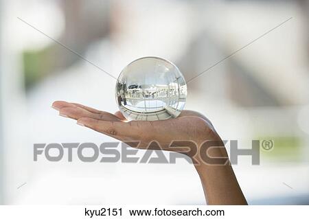 Close-up of a person's hand holding a crystal ball View Large Photo Image Stock Image - Close-up of a person's hand holding a crystal ball. Fotosearch