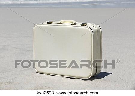 Close-up of a suitcase on the beach View Large Photo Image Stock Photo - Close-up of a suitcase on the beach. Fotosearch