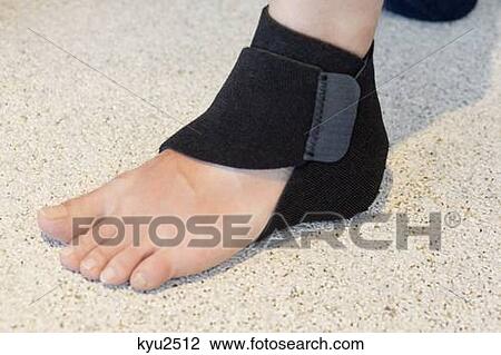 Close-up of heel wrap around the ankle of a person View Large Photo Image Stock Image - Close-up of heel wrap around the ankle of a person. Fotosearch