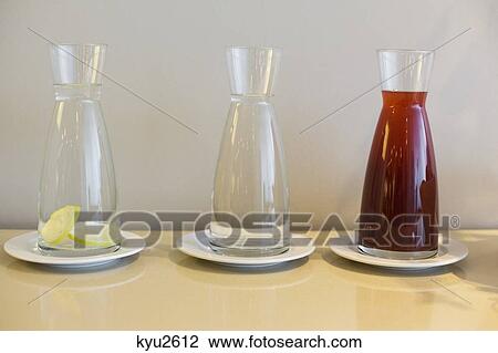 Close-up of pomegranate juice with lemony water and plain water in jars View Large Photo Image Stock Image - Close-up of pomegranate juice with lemony water and plain water in jars. Fotosearch