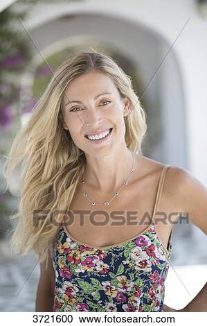 Stock Image - Close-up of smiling blond woman. Fotosearch