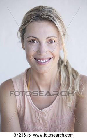 Stock Photography - Close-up of smiling blond woman. Fotosearch