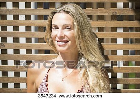 Picture - Close-up of smiling young woman. Fotosearch