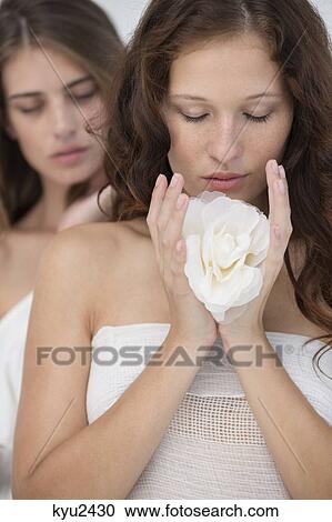 Stock Image - Close-up of two female friends. Fotosearch