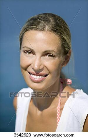 Close-up of young smiling woman View Large Photo Image Stock Image - Close-up of young smiling woman. Fotosearch
