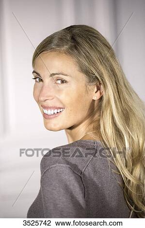 Stock Image - Close-up of young woman smiling. Fotosearch
