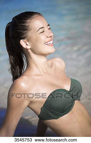 Close-up smiling young girl in the beach View Large Photo Image Stock Image - Close-up smiling young girl in the beach. Fotosearch