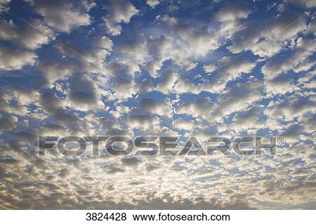 Cloudy sky at sunset. View Large Photo Image Stock Photo - Cloudy sky at sunset.. Fotosearch
