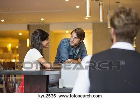 Stock Photography - Couple at a restaurant. Fotosearch