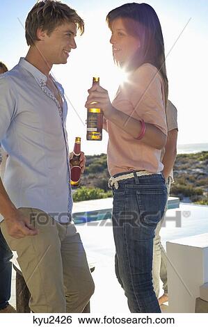 Stock Photograph - Couple dancing in a party. Fotosearch