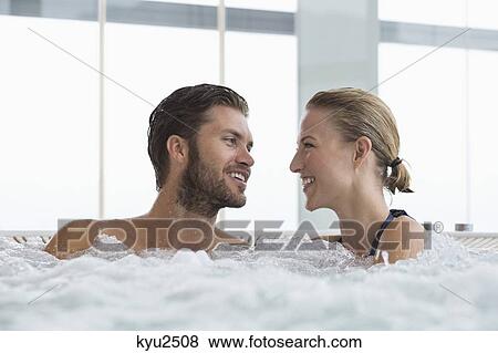 Couple in a hot tub View Large Photo Image Stock Photo - Couple in a hot tub. Fotosearch
