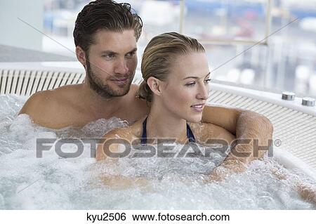 Stock Photograph - Couple in a hot tub. Fotosearch