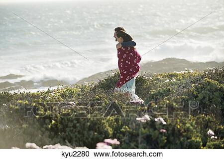 Couple walking on the beach View Large Photo Image Stock Image - Couple walking on the beach. Fotosearch