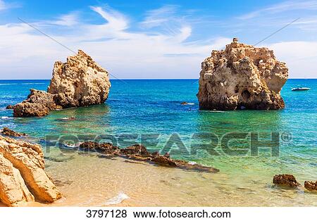 Stock Photo - Cove Praia Arrifes region of Algarve, Portugal. Fotosearch